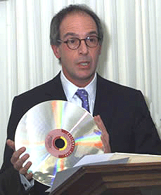 photo (43KB): Loyd Grossman with a videodisc of the Domesday Project, at the launch of the Digital Preservation Coalition, February 2002