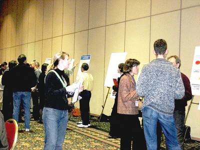 photo (89KB) : Figure 3 : Perusing the posters at Open Repositories 2007, Flickr image courtesy of Julie Allinson