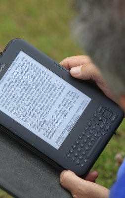 Man With Kindle Close Up by Tina Phillips