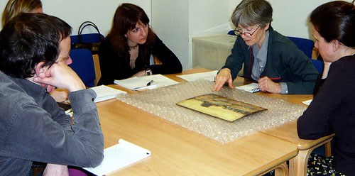 photo (39KB) : Figure 2 : E-Curator Workshop: object handling session discussing a painting by Walter Westley Russell 