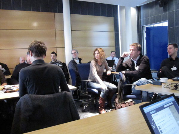 photo (61KB) : A University of Bolton meeting room full of standards enthusiasts. Photo courtesy of Tore Hoel