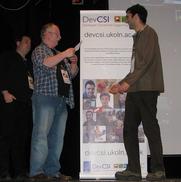 Figure 1: Roger Greenhalgh (left) receiving the Picture This! prize at Dev8D